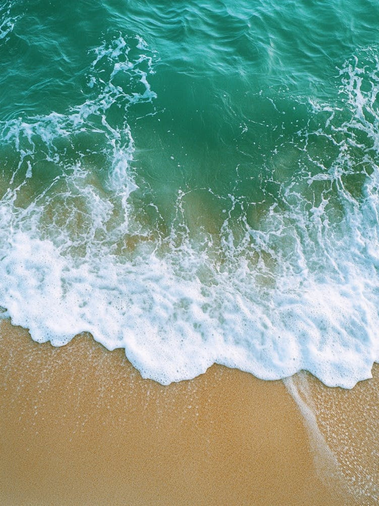 Sand And Water On The Beach