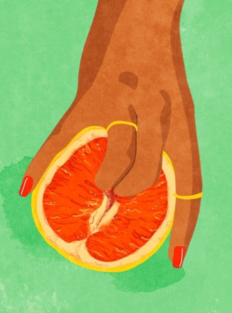 Hand Holding Grapefruit