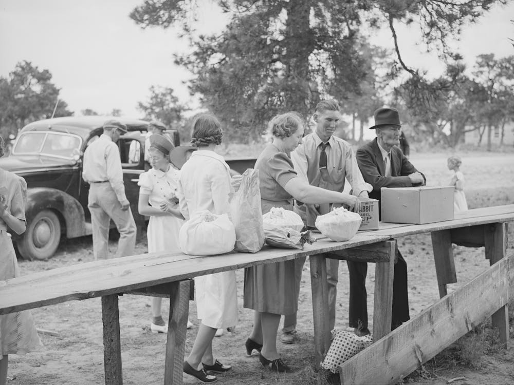 Putting Out The Food For Dinner On The Grounds At All Day Community Sing, Pie Town, New Mexico By Russell Lee