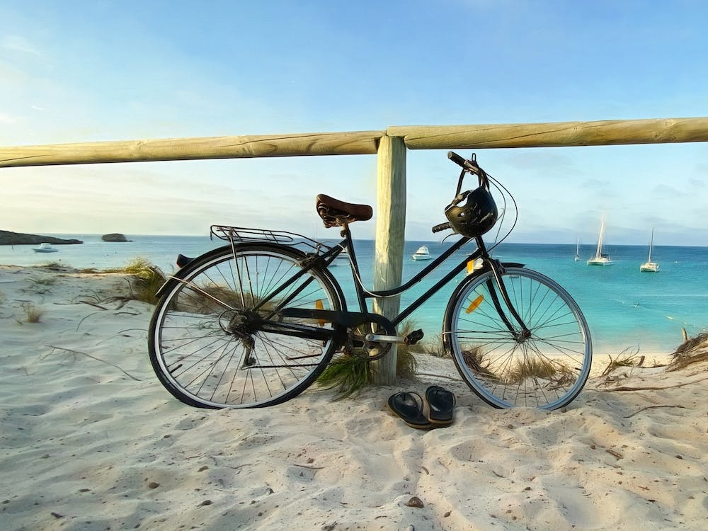 Bicycle By Beach Fence