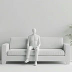 Mannequin Sitting On Couch