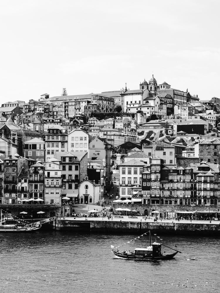The Tiny Boat And The  City Of Porto Portugal
