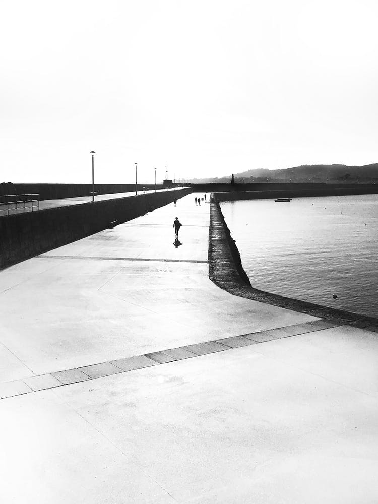 Black & White Lone Pier Walker