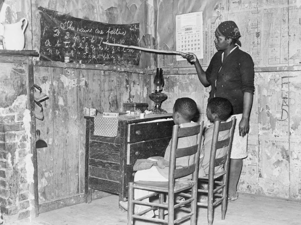Mother Teaching Children Numbers And Alphabet In Home Of Sharecropper, Transylvania, Louisiana By Russell Lee