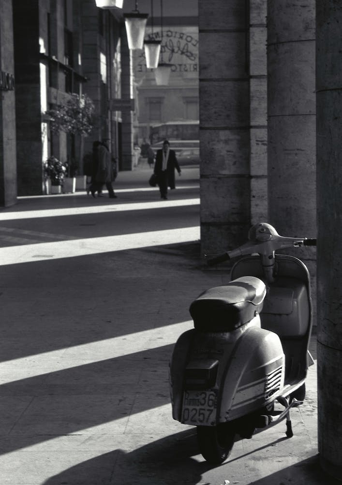 Scooter Under Colonnade In Rome Black And White