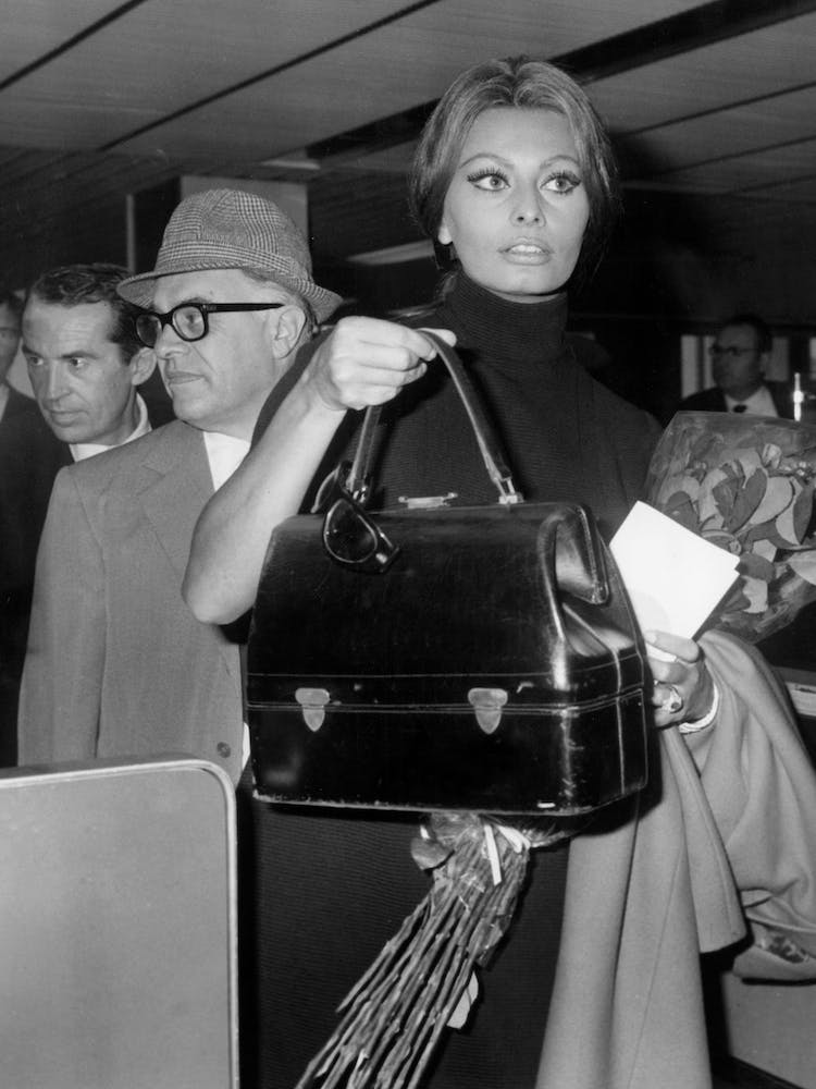 The Italian Actress Sophia Loren And The Productor Carlo Ponti At The Airport Of Orly For The Flyght To Usa