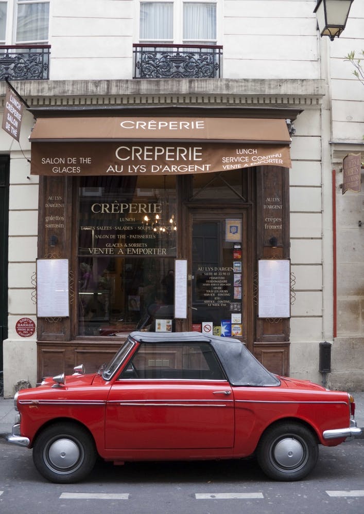 Red Autobianchi Outside Creperie In Paris