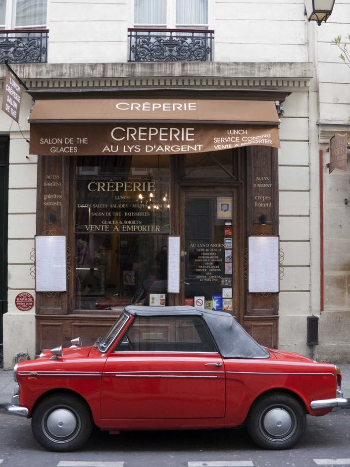 Red Autobianchi Outside Creperie In Paris