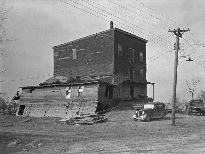 Old Flour Mill Damaged By The Flood, Note Wrought Iron Streetlight Fixture, Shawneetown, Illinois By Russell Lee