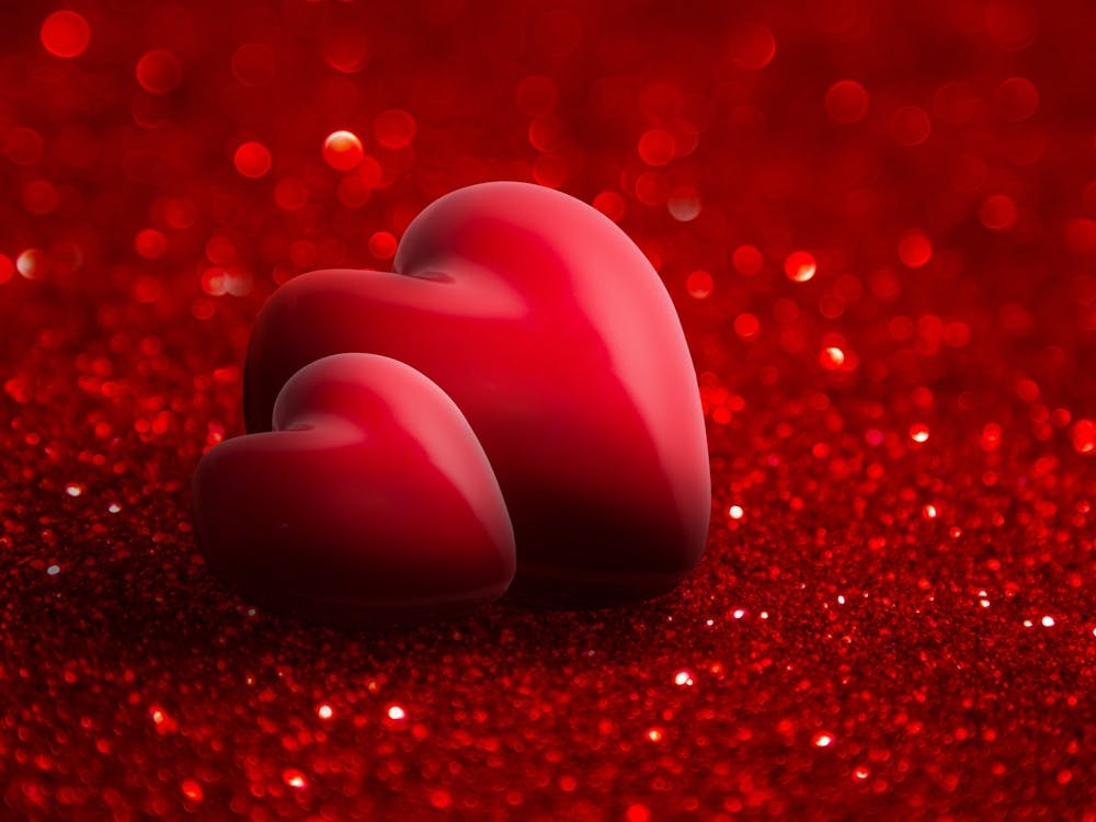 Two Hearts On Red Glitter
