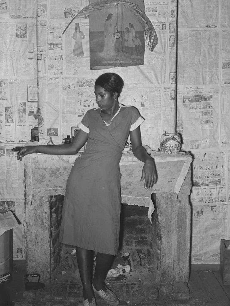 Girl In Front Of Fireplace In Home Along Levee Near Norco, Louisiana By Russell Lee