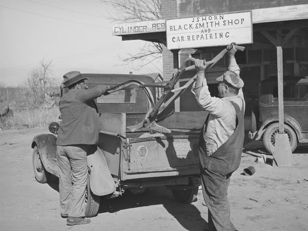 Pomp Hall, Tenant Farmer, And Smith Loading Pomp S Plow Into Truck After It Has Been Sharpened, Depew, Oklaho