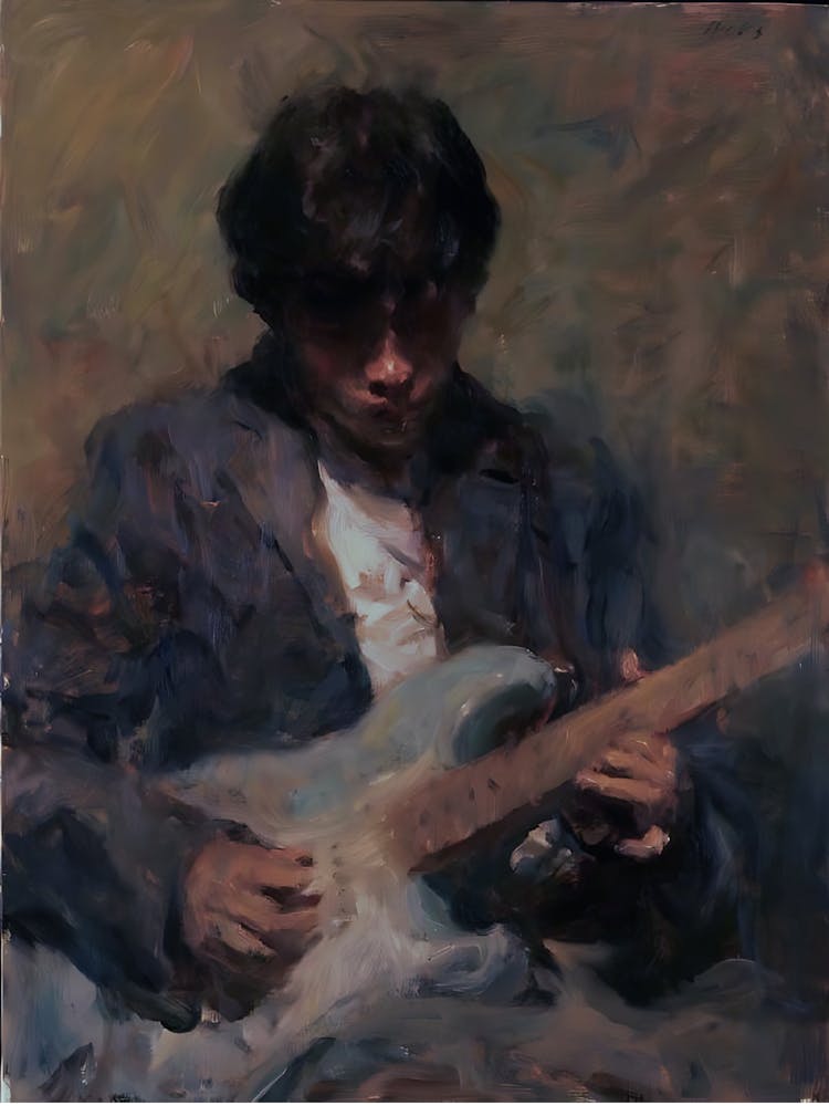Man Playing An Electric Guitar