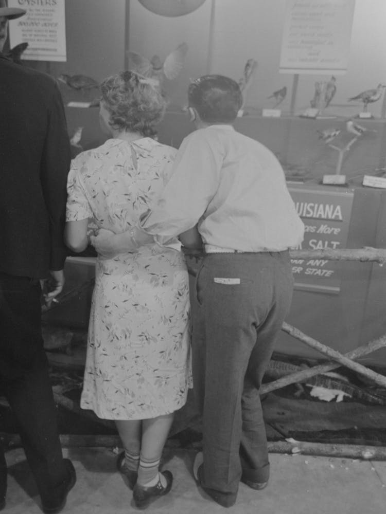 Loving Couple Look At Exhibit, State Fair, Donaldsonville, Louisiana By Russell Lee
