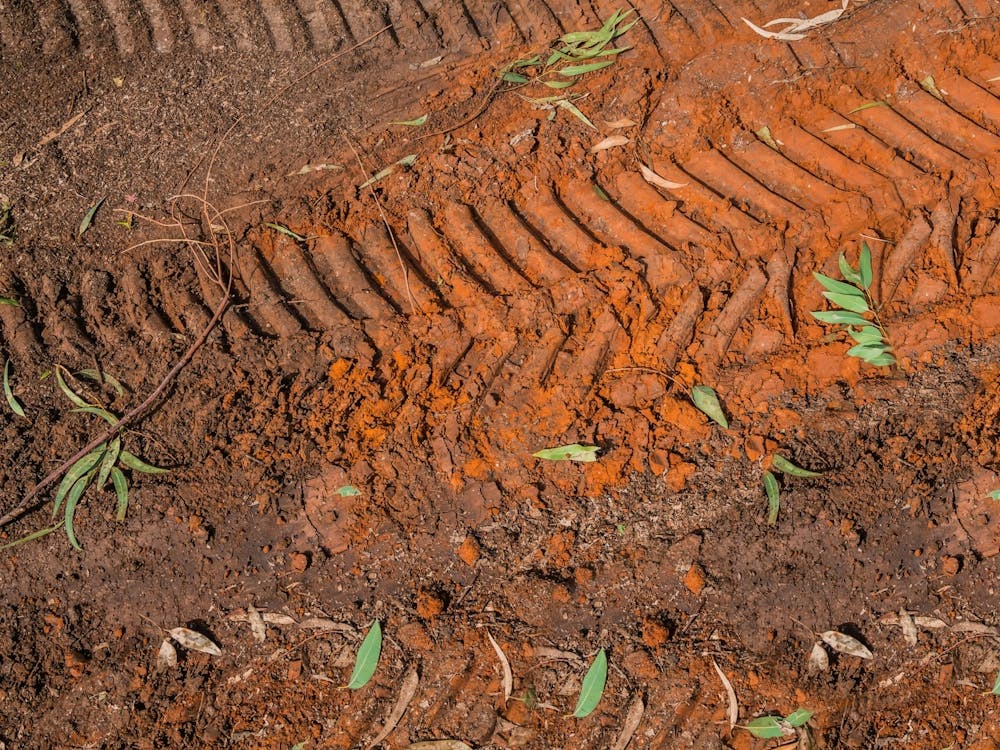 Texture Of Brown Mud With Tractor Tyre Tracks 1