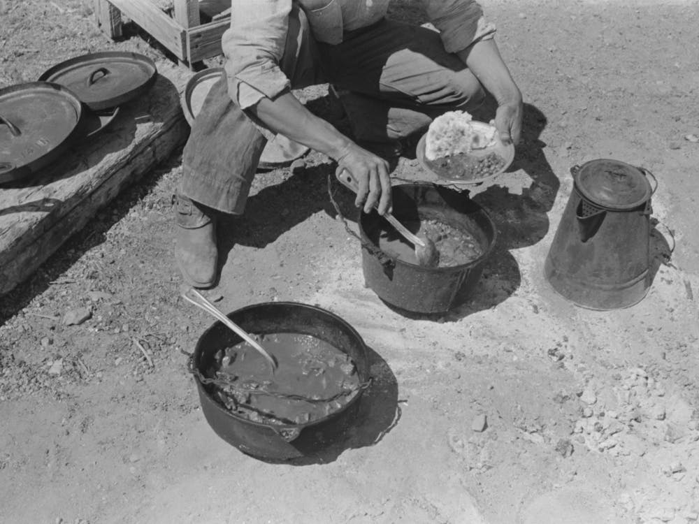Cowboy Dishing Up Chili At Noonday Dinner, Cattle Ranch Near Marfa, Texas By Russell Lee