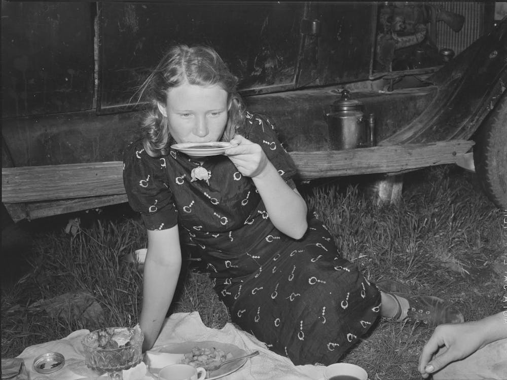 Migrant Woman Drinking Coffee From Saucer While Camped Near Prague, Oklahoma By Russell Lee