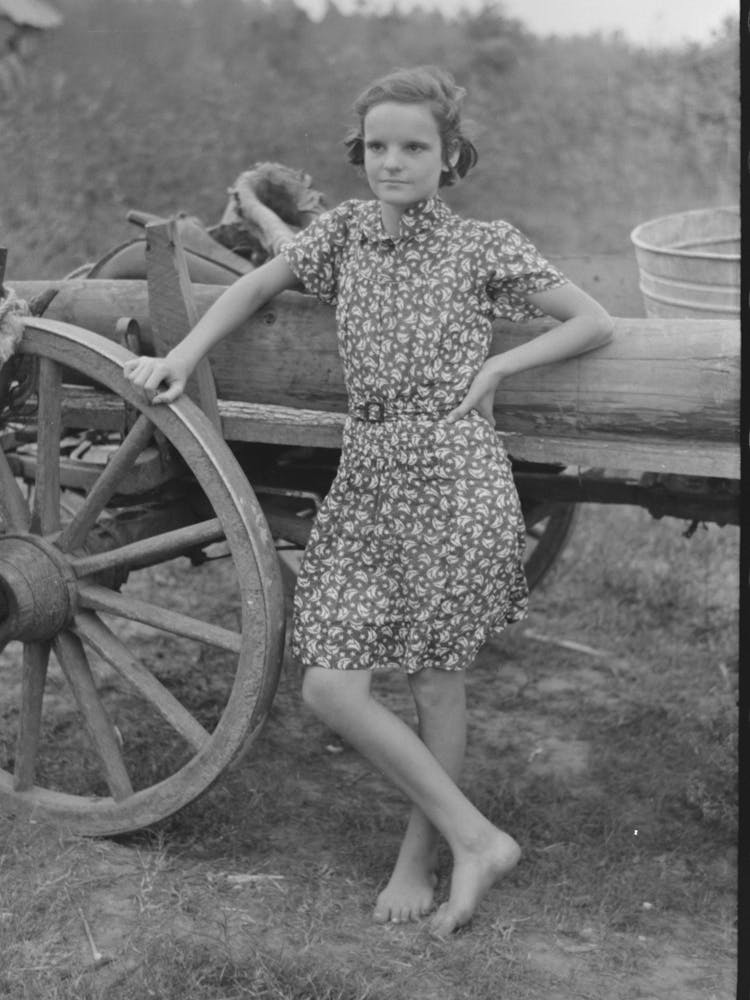 Farm Girl Leaning On Wagon, Near Morganza, Louisiana By Russell Lee