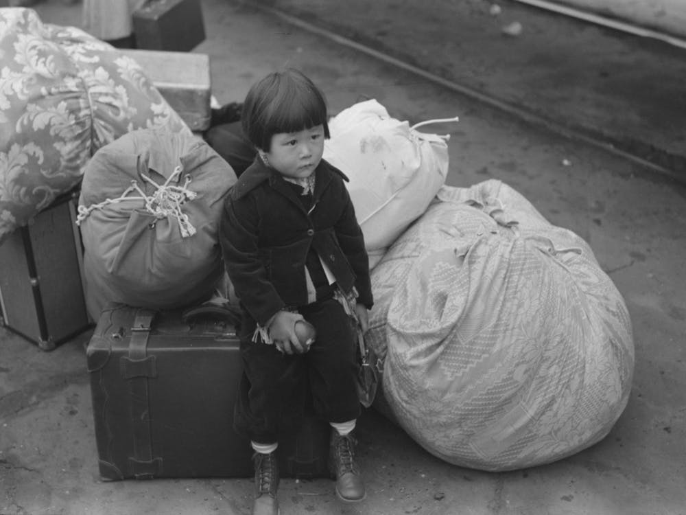 Los Angeles, California, Japanese American Child Who Is Being Evacuated With His Parents To Owens Valley By