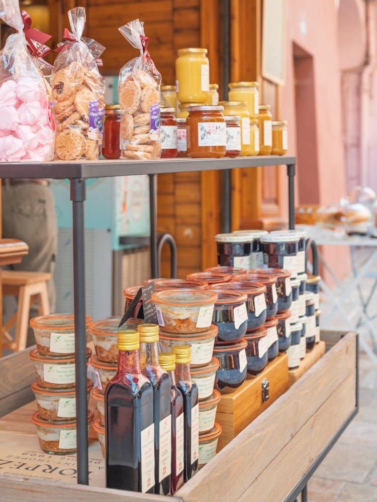 Local produce in a stall in Bourg St. Mortiz in France - summer pastel pink street and travel photography by Christa Stroo Photography