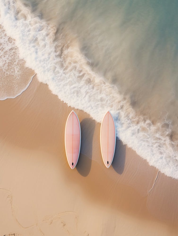 surfboards laying on the beach