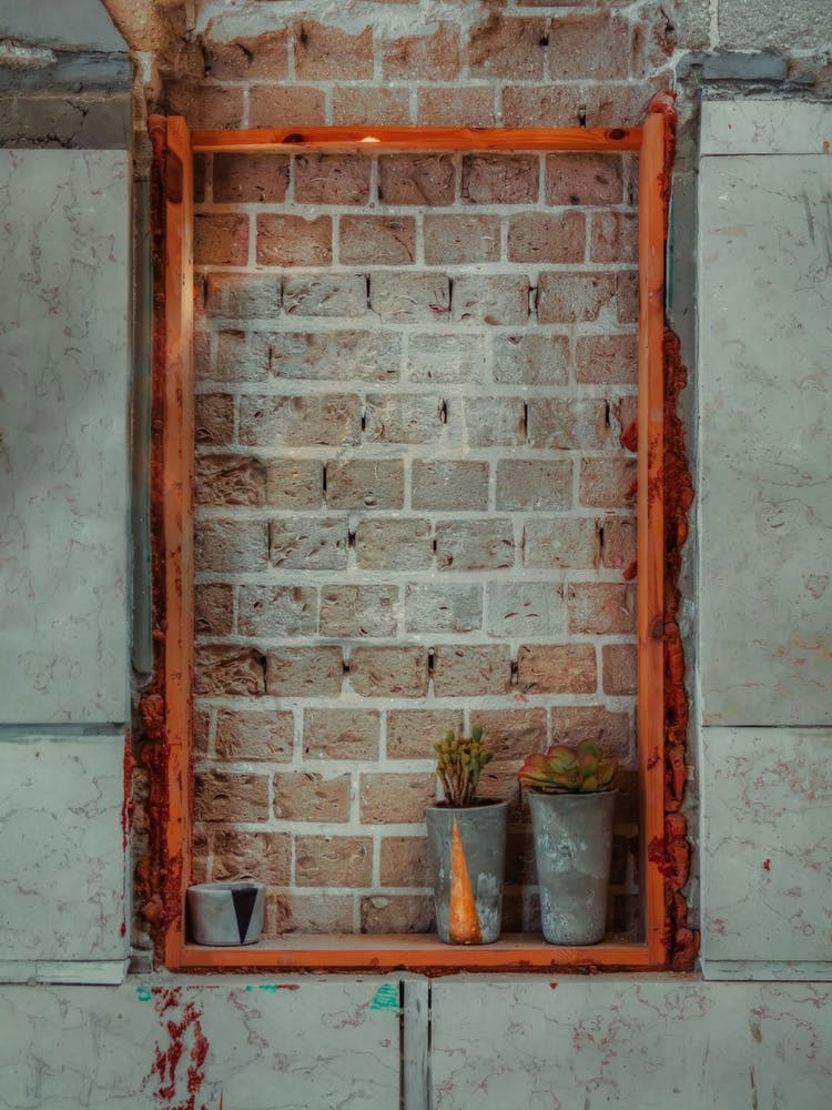 Window Sealed With Red Bricks In An Abandoned Building 2