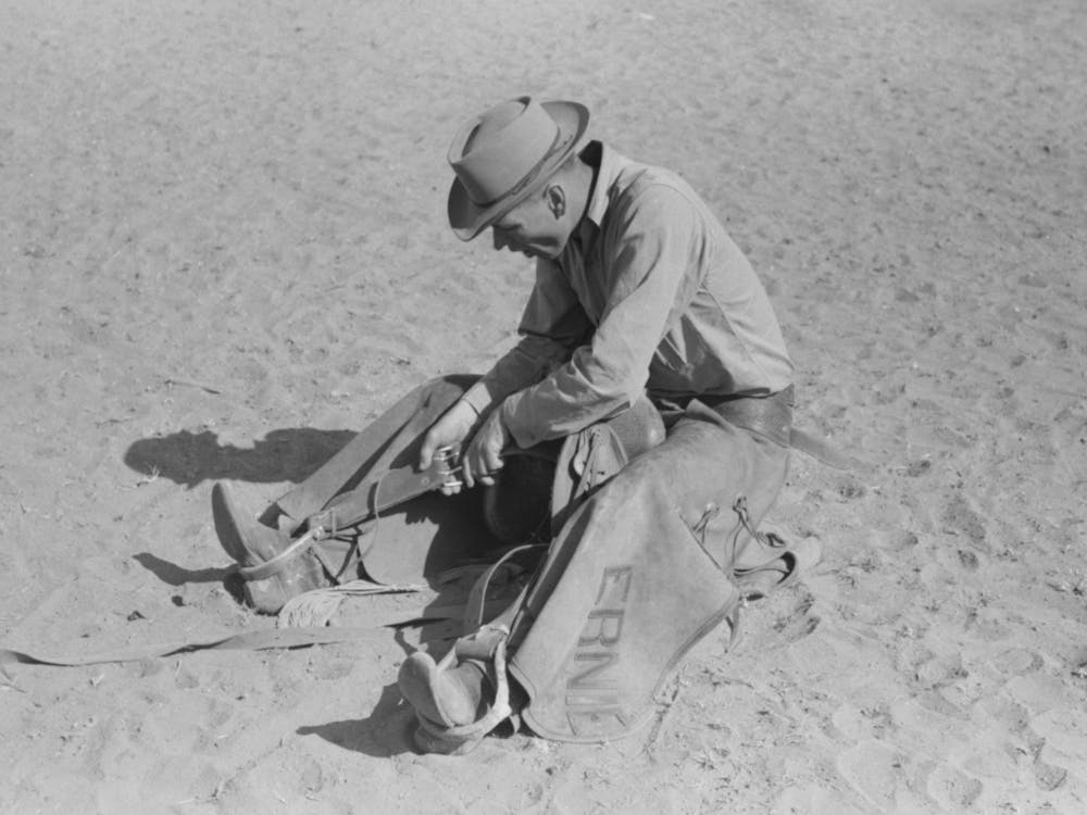 Cowboy Testing Stirrups At Rodeo Before Broncbusting, Quemado, New Mexico By Russell Lee