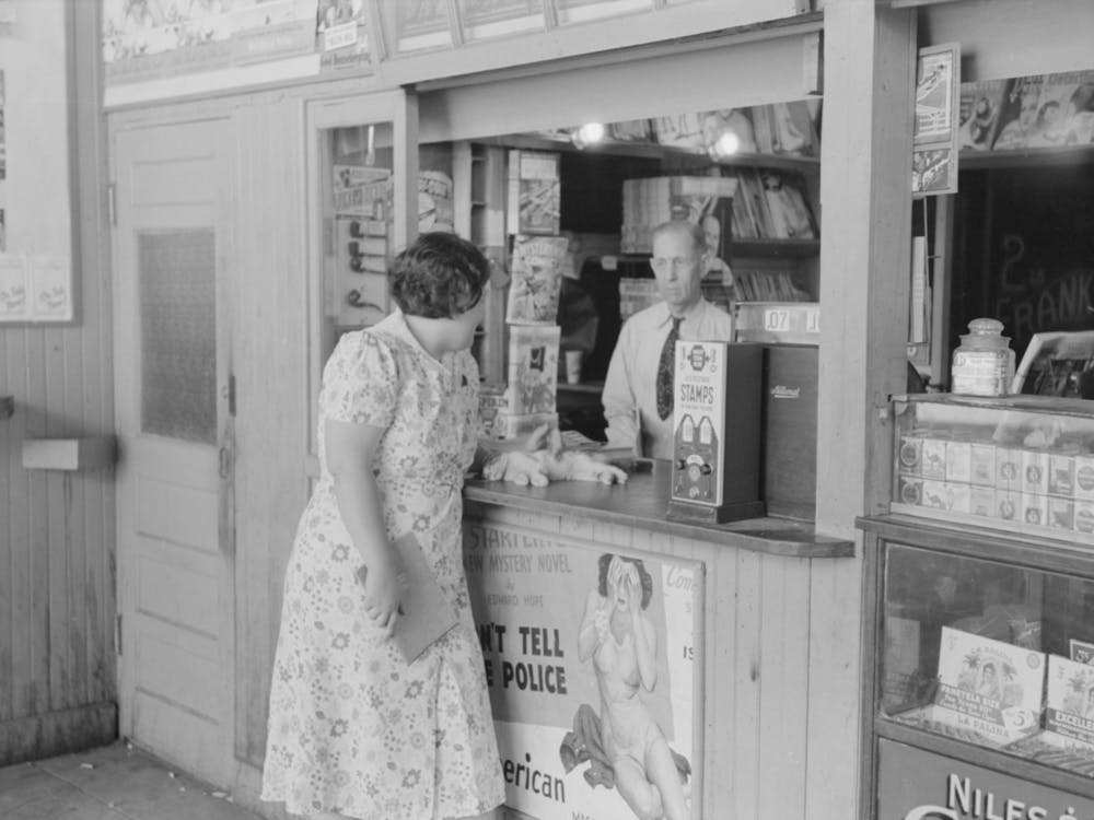 Tobacco Stand Keeper Talking With Woman, Streetcar Terminal, Oklahoma City, Oklahoma By Russell Lee