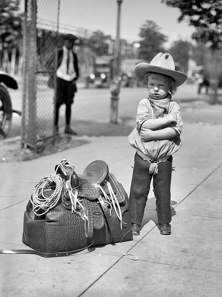 Little Cowboy With Saddle Black and White Vintage Photo