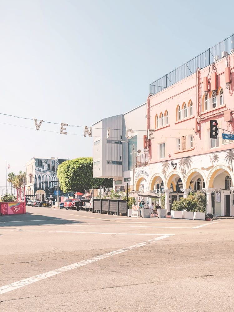 Los Angeles, USA I Venice sign at sunrise at Venice beach in pastel pink summer colors aesthetic photography with West coast Pacific coastal seaside architecture and a boho vibes retro vintage ambience