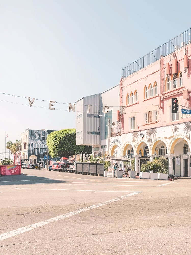 Los Angeles, USA I Venice sign at sunrise at Venice beach in pastel pink summer colors aesthetic photography with West coast Pacific coastal seaside architecture and a boho vibes retro vintage ambience