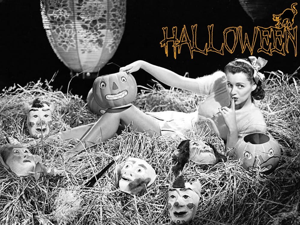 Pin Up Girl Posing In A Hay Full Of Masks