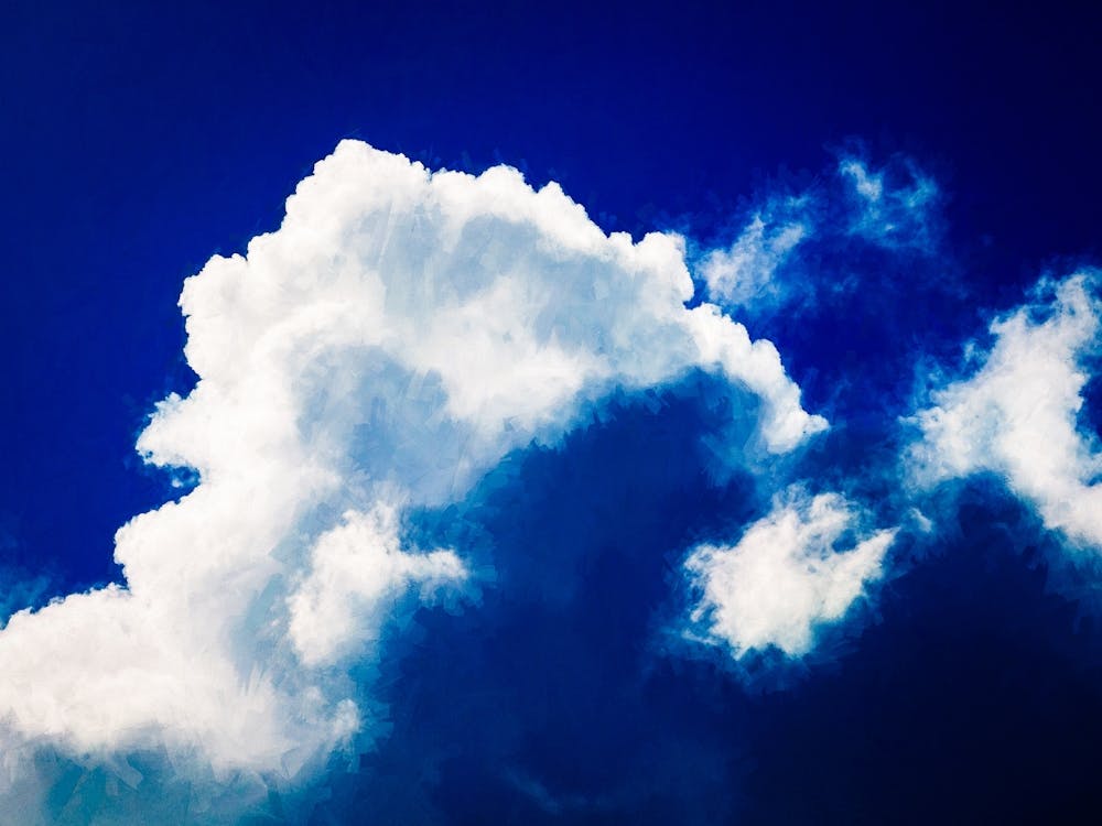 Fluffy Cloud In A Darkening Sky