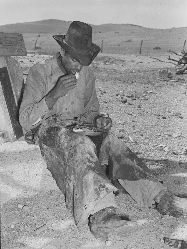 Mexican Cowboy Eating Dinner After The Roundup, Cattle Ranch Near Marfa, Texas By Russell Lee