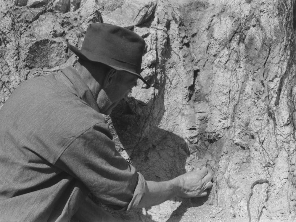 Prospector Taking A Sample Of Dirt From Creek Bed Which Contains Scattered Gold, Pinos Altos, New Mexico B