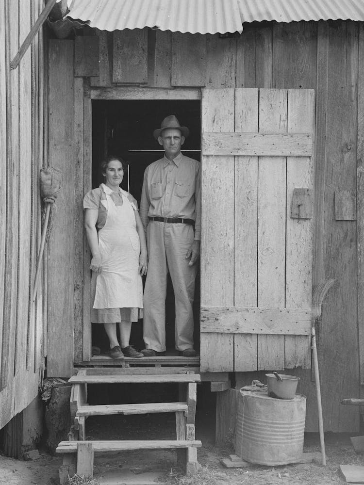 Mr And Mrs Emil Kimball Standing In Doorway Of Farm Home, They Will Participate In Tenant Purchase Progra