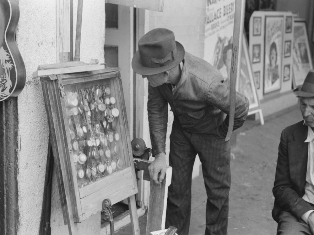 Man Looking At Cases Of Watches, Waco, Texas By Russell Lee