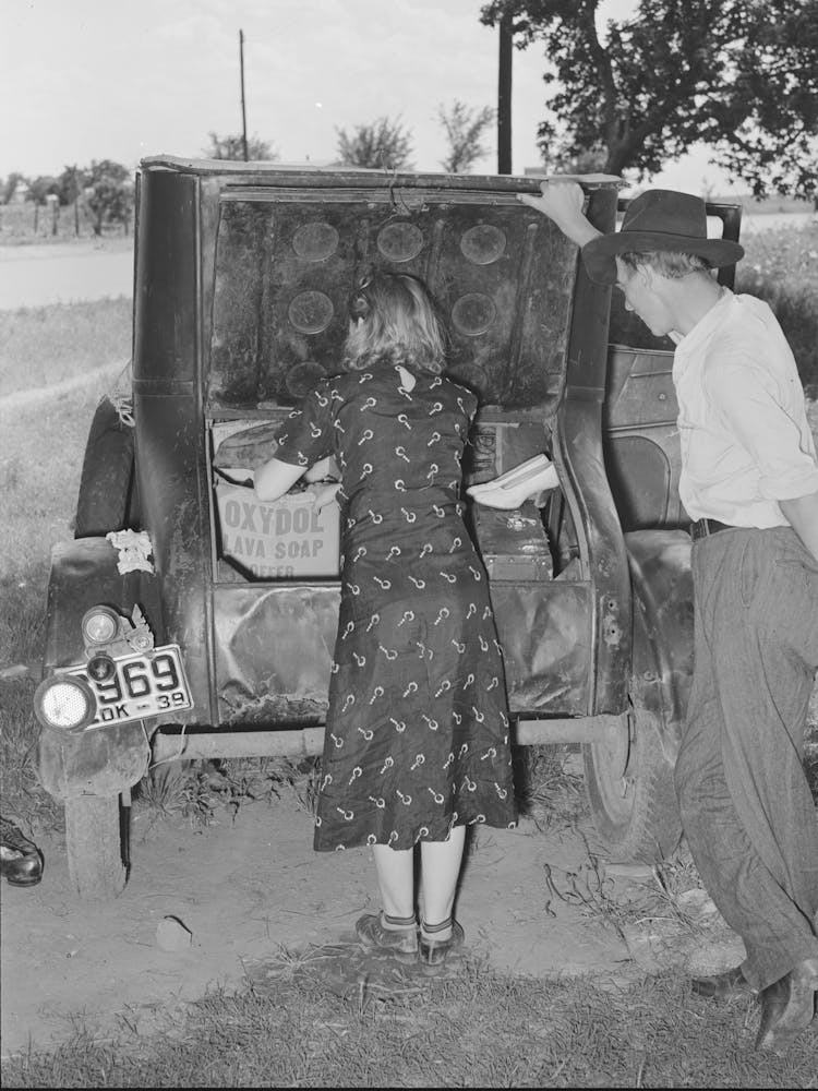 Migrants Loading Rear Deck Of Automobile While Camped Near Prague, Oklahoma, Lincoln County, Oklahoma
