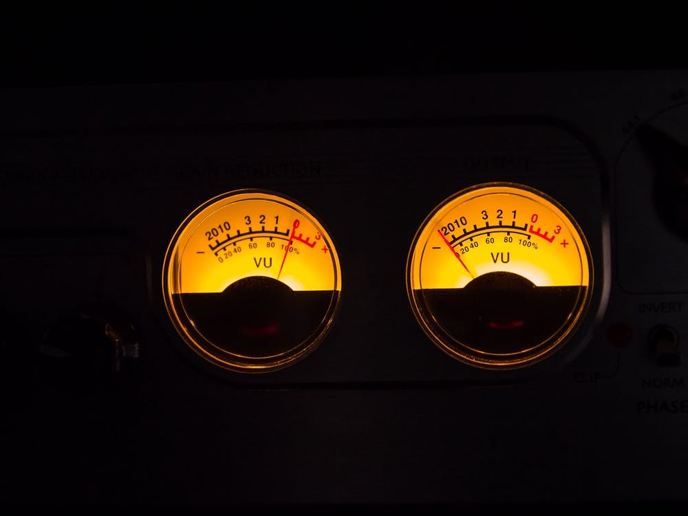 Analog Vu Meters Glowing On Black Background