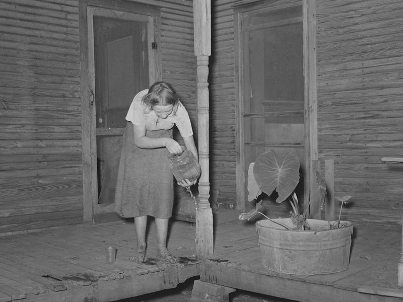 Front Porch Of Tenant Farmer S House Near Muskogee, Oklahoma, Daughter Is Getting Ready To Change Water In Goldfis