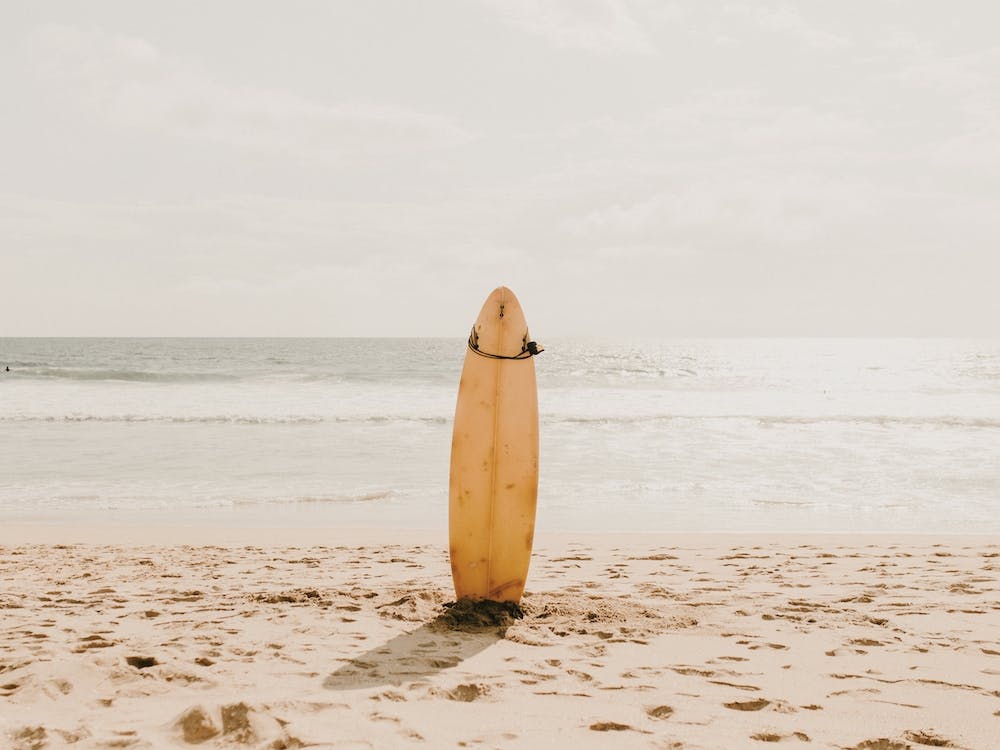 Yellow Surfboard Beach