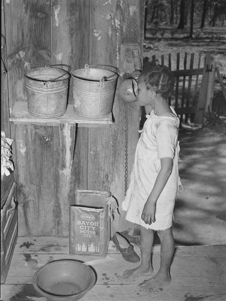 Daughter Of Sharecropper Drinking From Hollow Gourd, Near Marshall, Texas By Russell Lee
