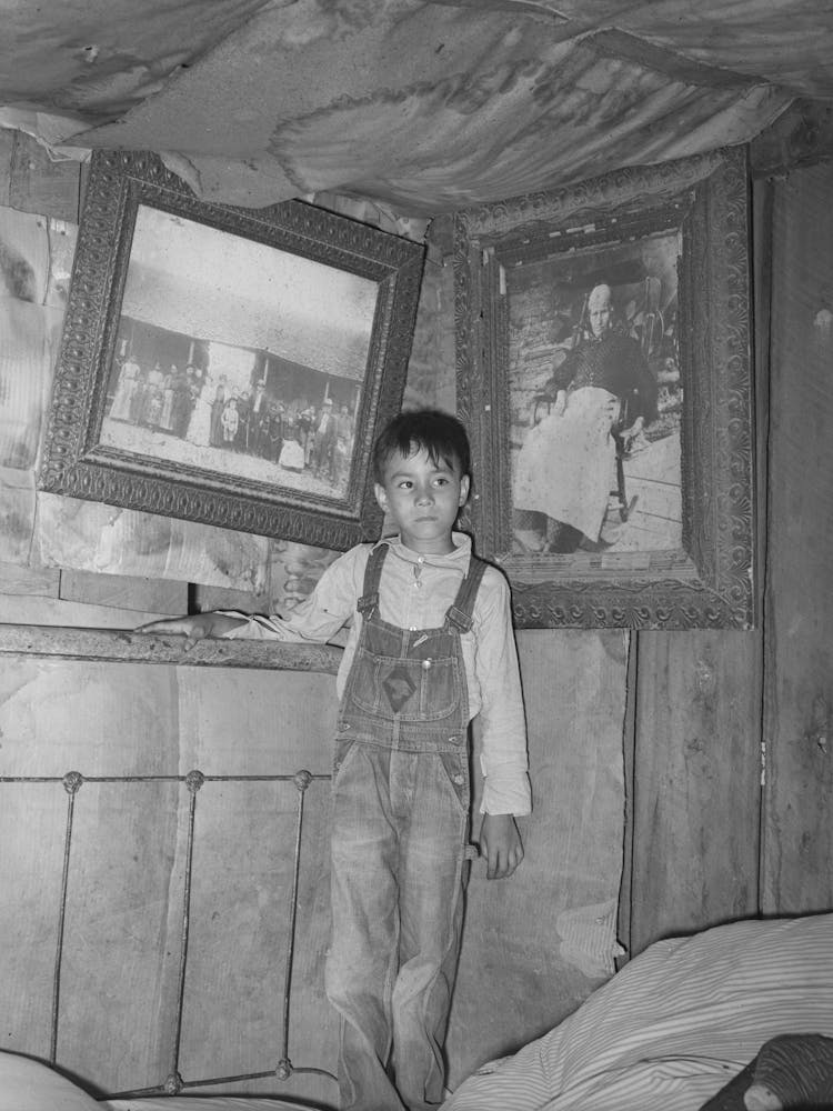 Indian Boy Between Portraits Of His Ancestors, Near Sallisaw, Oklahoma By Russell Lee
