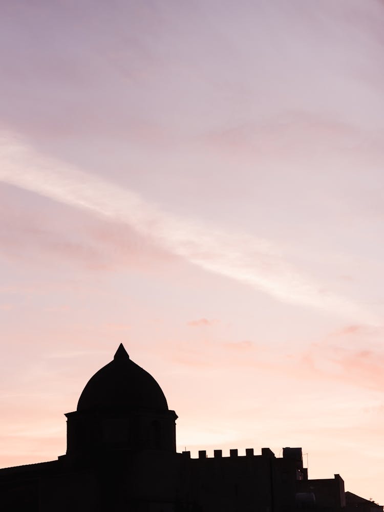Silhouette Of A Church At Purple And Pink Sunset In Erice