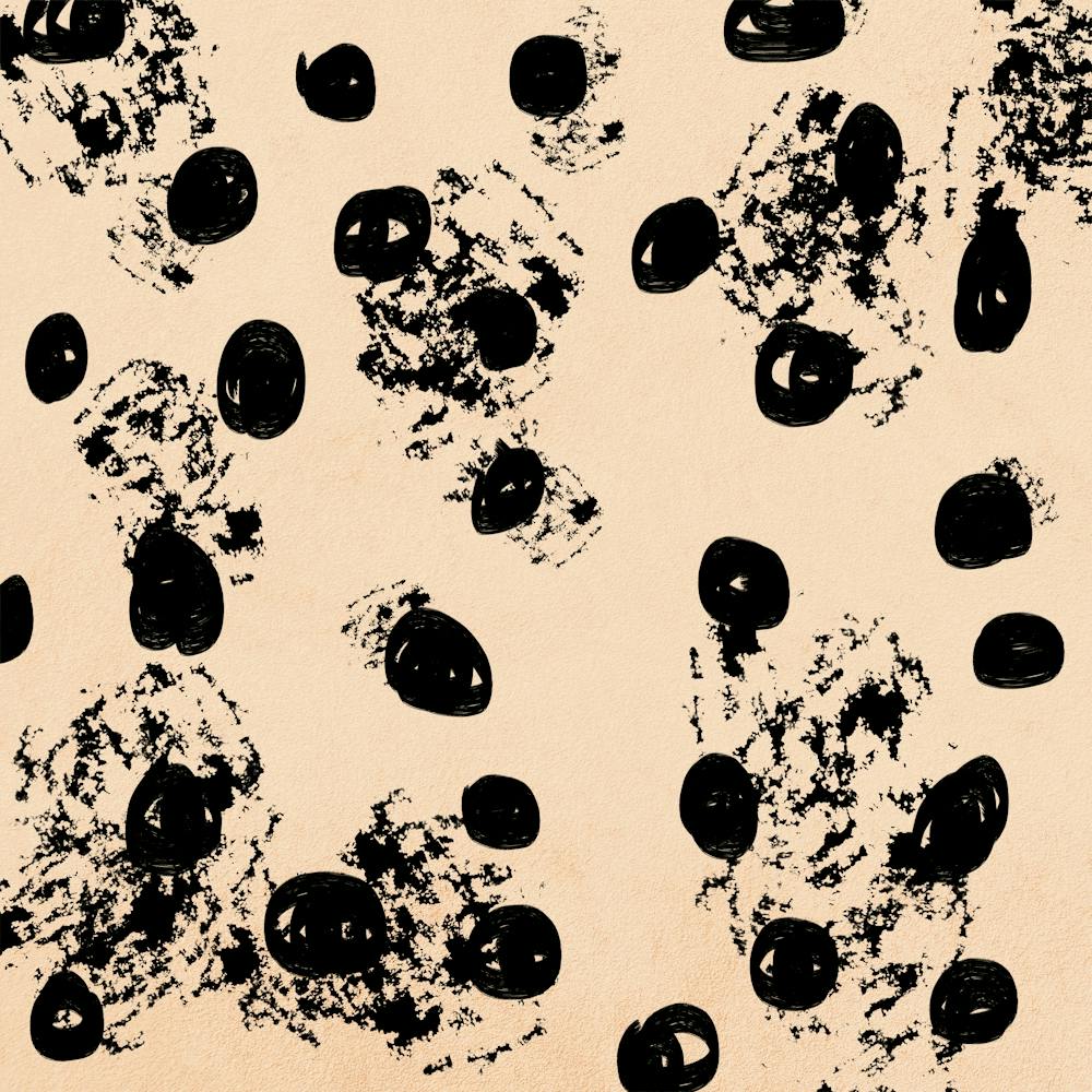 Black Dots On A Peach Fuzz Background