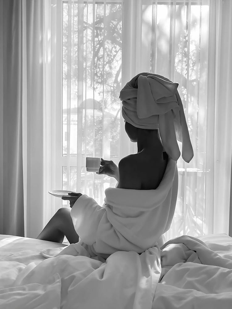 Woman Drinking Coffee In Window