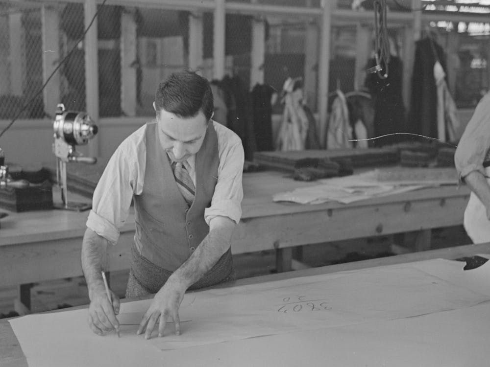 Louis Gushen, Chief Cutter In The Cooperative Garment Factory At Jersey Homesteads, Is Cutting The Pattern For