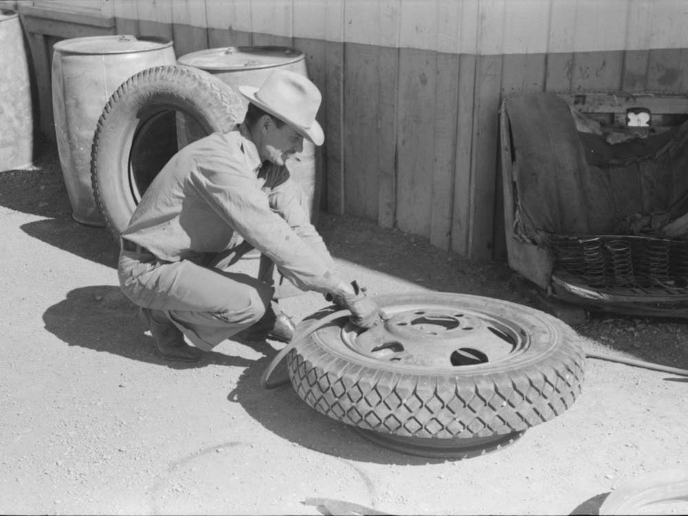 Changing Tire At The Garage, Pie Town, New Mexico By Russell Lee