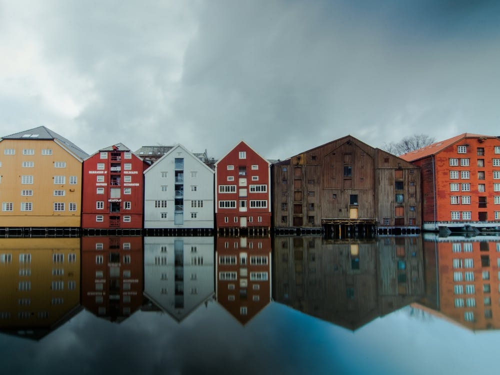 Trondheim Norway reflection in the river of the city | Street travel photography