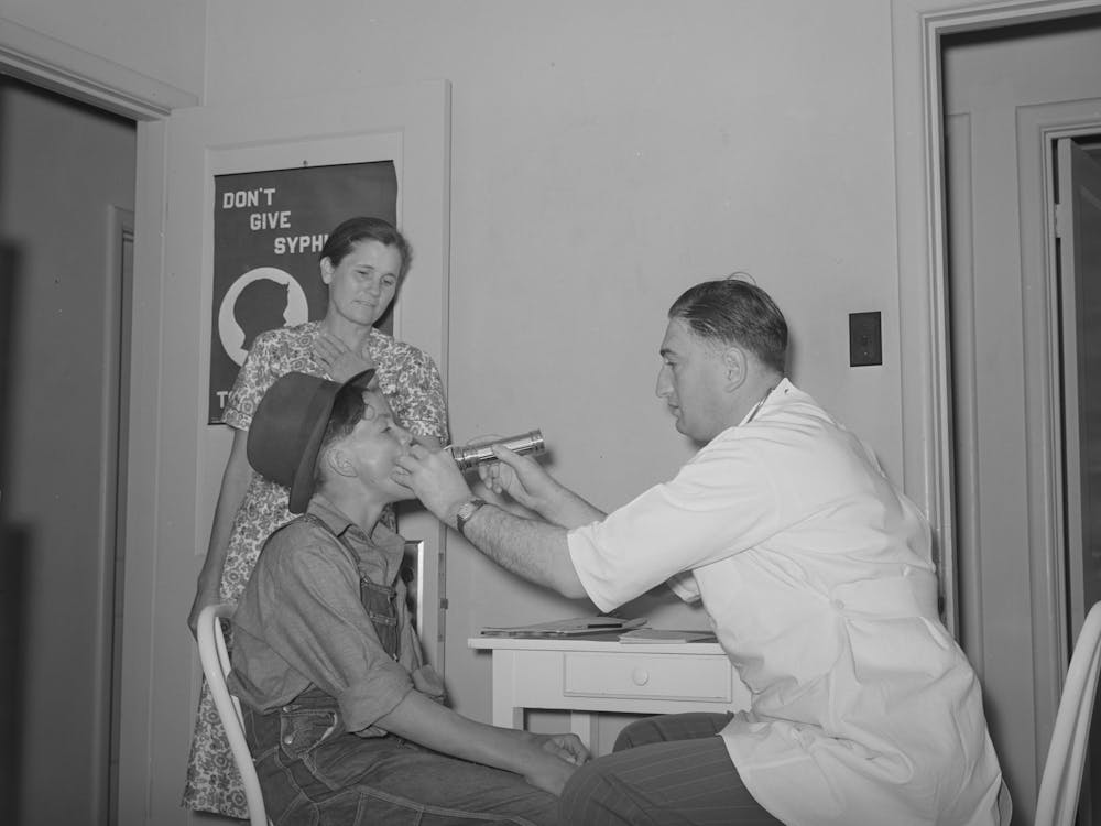 Examination By Doctor At The Clinic Of The Agua Fria Migratory Labor Camp, Arizona By Russell Lee